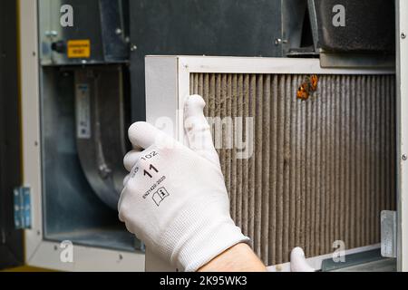 Replacing filter in the central ventilation system. hvac filter replacing home central air system Stock Photo