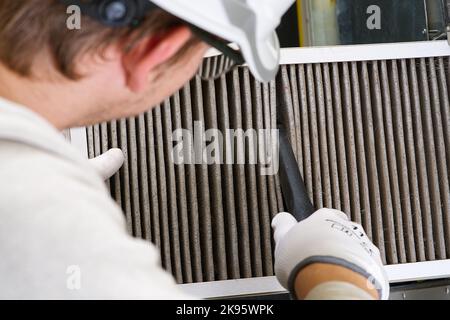 Replacing filter in the central ventilation system. hvac filter replacing home central air system Stock Photo