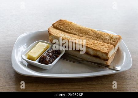 Traditional Chinese sandwich toast bread served with butter and jam Stock Photo
