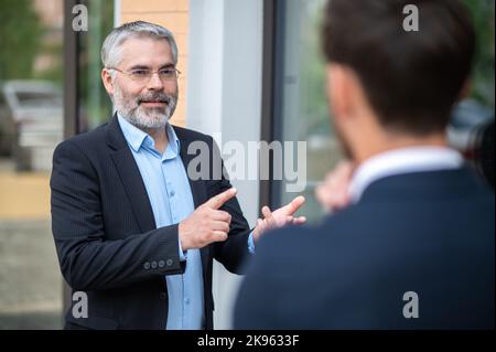 Two business partners having negotiations Stock Photo