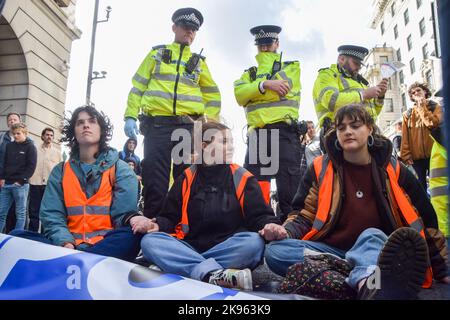 London, England, UK. 26th Oct, 2022. Just Stop Oil activists glued their hands and blocked Piccadilly outside The Ritz hotel, as they continue their protests demanding the government stops issuing new fossil fuel licences. (Credit Image: © Vuk Valcic/ZUMA Press Wire) Stock Photo