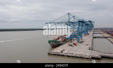 Klang, Malaysia - October 09, 2022: Cranes at the port Klang near Kuala Lumpur. Container crane at Klang Harbor. Aerial view on a container ship which Stock Photo