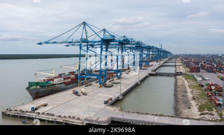 Klang, Malaysia - October 09, 2022: Cranes at the port Klang near Kuala Lumpur. Container crane at Klang Harbor. Aerial view on a container ship which Stock Photo