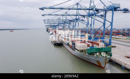 Klang, Malaysia - October 09, 2022: Cranes at the port Klang near Kuala Lumpur. Container crane at Klang Harbor. Aerial view on a container ship which Stock Photo