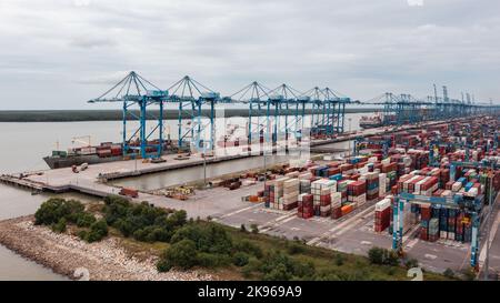 Klang, Malaysia - October 09, 2022: Cranes at the port Klang near Kuala Lumpur. Container crane at Klang Harbor. Aerial view on a container ship which Stock Photo