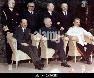 Potsdam Conference, July-August 1945. The Big Three pose with their principal advisors, at Potsdam, Germany, circa 28 July 1 August 1945. The three heads of government are (seated, left to right): British Prime Minister Clement Atlee; U.S. President Harry S. Truman; Soviet Premier Joseph Stalin. Standing behind them are (left ot right): Fleet Admiral William D. Leahy, USN, Truman's Chief of Staff; British Foreign Minister Ernest Bevin; U.S. Secretary of State James F. Byrnes; Soviet Foreign Minister Vyacheslav Molotov. Stock Photo