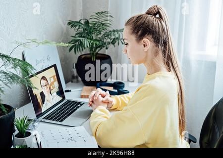 Young woman student applicant having online virtual video call job interview meeting with female hr recruiter or employer. Distance remote recruitment Stock Photo