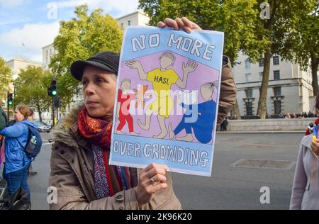 London, UK. 26th October 2022. Protesters outside Downing Street. Hundreds of homeless and overcrowded families marched in Westminster demanding 3, 4, 5 -bed council homes. Credit: Vuk Valcic/Alamy Live News Stock Photo