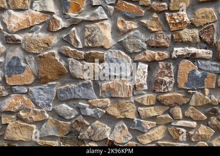 texture of an exterior wall made of natural stones Stock Photo