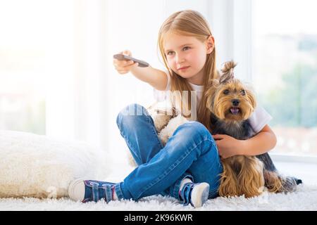 Switching channels with a friend Stock Photo