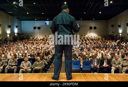 Speaking to a standing-room-only audience, former NFL running back and 1982 Heisman Trophy winner Herschel Walker speaks to military and civilian Airmen at Dover Air Force Base in Delaware about his own personal experience with mental health issues and treatment by seeking help through behavioral health services. (USA) Stock Photo