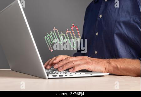 Stock markets and trade concept. Trader at laptop with online finance chart, candlesticks bar, analyzing investments. Financial concept. High quality photo Stock Photo