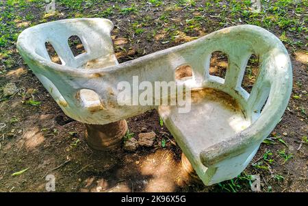 Artfully curved stone bench in the city park in Playa del Carmen Quintana Roo Mexico. Stock Photo