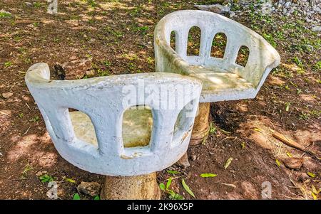 Artfully curved stone bench in the city park in Playa del Carmen Quintana Roo Mexico. Stock Photo