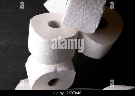 photo white toilet paper on a black background Stock Photo