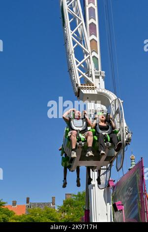 Middleburg, Netherlands - August 2022: People enjoying a ride on a tall ...