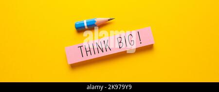 Close up conceptual shot of a business idea showing Think Big Stock Photo