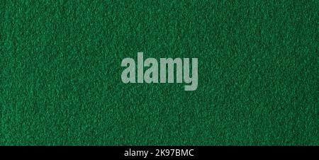Green color felt textile fabric material texture background. Abstract monochrome dark blue color felt background Stock Photo