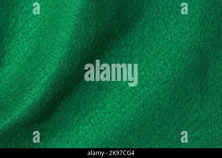 Green hue color felt textile fabric texture background. Abstract geometric wave background Stock Photo