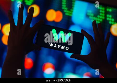 In this photo illustration, the Waymo logo is displayed on a smartphone ...