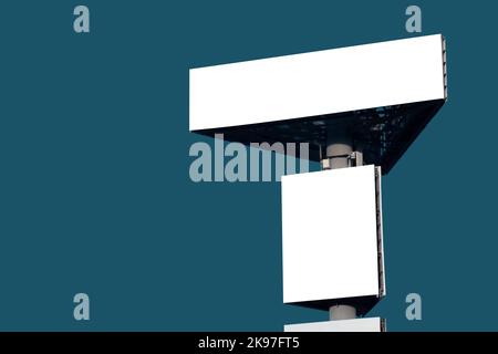 Mock up: two blank green billboards against blue-green background Stock Photo