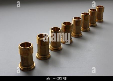 Copper Threaded Fittings For Water Pipe Connection Lined Up On White Background Stock Photo
