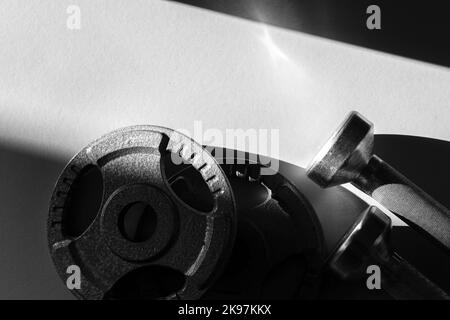 Close up of dumbbells on grey backgound. Sport and fitness equipment. Horizontal sport poster, greeting cards, headers, website. Stock Photo