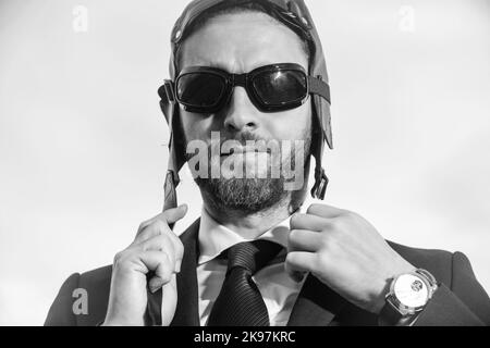 businessman in suit and pilot hat get ready Stock Photo