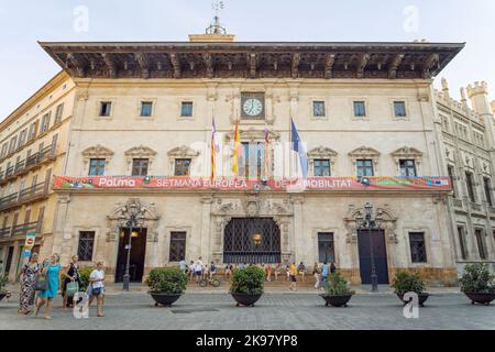Palma de Mallorca, Spain - September the 18th 2022: Front view of the town hall building in Palma de Mallorca, with people passing by Stock Photo