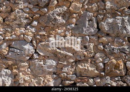 Detailed textured background of sandstone old wall with blocks light yellow colored Stock Photo