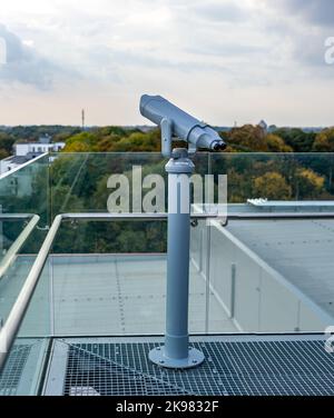 The binoculars are mounted on a solid, rotating column. Photo taken in natural, soft light. Stock Photo