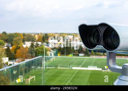 The binoculars are mounted on a solid, rotating column. Photo taken in natural, soft light. Stock Photo