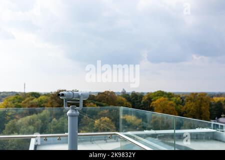 The binoculars are mounted on a solid, rotating column. Photo taken in natural, soft light. Stock Photo