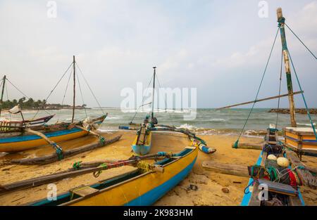 Small plastic fishing boats on a beach, Sri Lanka Stock Photo - Alamy