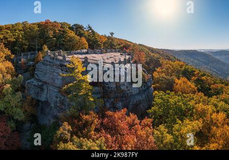 View up the Cheat River gorge in the autumn with Coopers Rock overlook in the colorful trees near Morgantown, West Virginia Stock Photo