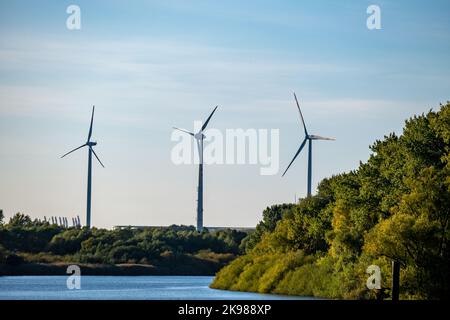 three wind turbines on the water Stock Photo