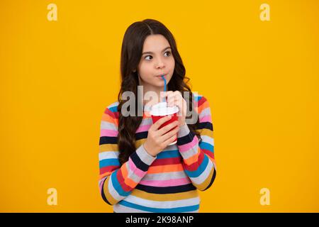 School girl holding coffee cup, learning and education. Coffee break and school recess. Back to school. Teenager student plastic takeaway cup drink Stock Photo