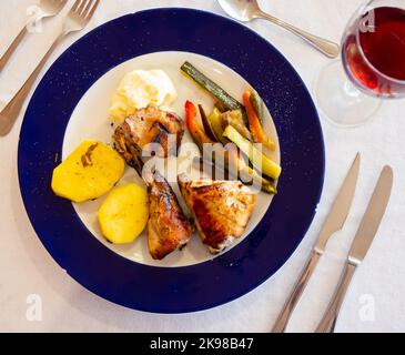 Roasted rabbit served with vegetable garnish Stock Photo