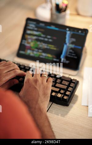 Hands of software developer typing on keyboard Stock Photo
