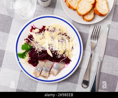 Beetroot served with cheese and pickled mackerel Stock Photo