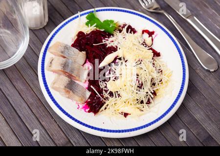 Beetroot served with cheese and pickled mackerel Stock Photo