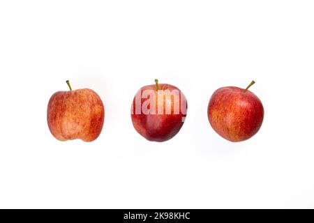Three apples on a white background. Three sweet red apples on a seamless white background Stock Photo
