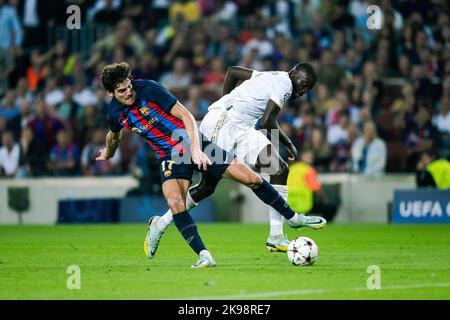 Barcelona, Spain. 26th Oct, 2022. Marcos Alonso (L) of Barcelona vies with Dayot Upamecano of Bayern Munich during the UEFA Champions League Group C soccer match between FC Barcelona and Bayern Munich at Camp Nou Stadium in Barcelona, Spain, on Oct. 26, 2022. Credit: Joan Gosa/Xinhua/Alamy Live News Stock Photo