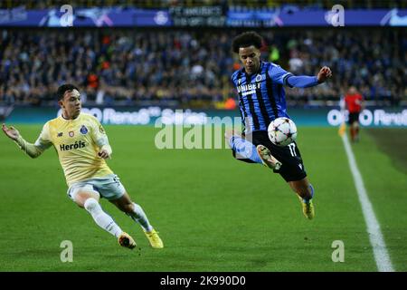 Bruges, Belgium. 26th Oct, 2022. Tajon Buchanan (R) of Club Brugge stops the ball during the UEFA Champions League Group B football match between Club Brugge and FC Porto in Bruges, Belgium, Oct. 26, 2022. Credit: Zheng Huansong/Xinhua/Alamy Live News Stock Photo