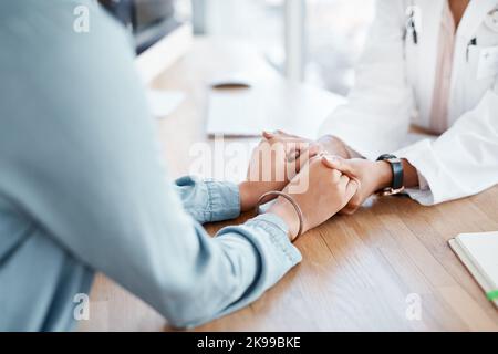 There will always be someone to help. a female doctor comforting her patient. Stock Photo