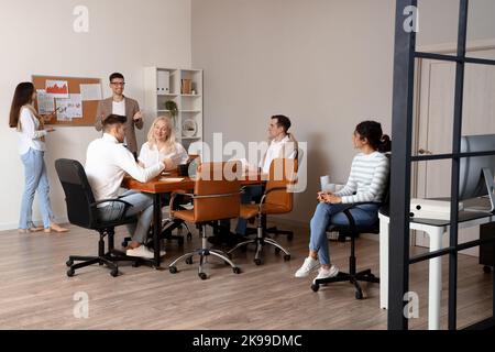 Business co-workers giving presentation during meeting in office Stock Photo