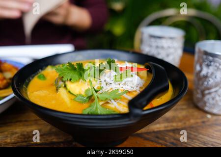 A bowl of red chicken curry at Holy Basil, a Thai and Laotian restaurant in Parramatta, western Sydney — New South Wales, Australia Stock Photo