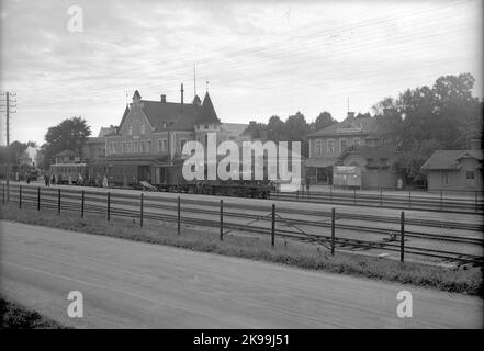 VGJ Lok 6 by train, (Västergötland - Gothenburg Railway) The station was built in 1873-74 by LSSJ., (Lidköping - Skara - Stenstorp Railway) The original station house was replaced in 1899, in connection with VGJ, (Västergötland - Gothenburg Railway) connection, with one New building (two floors, plastered). This building was extended in 1919, and underwent in 1942 change and modernization. Stock Photo