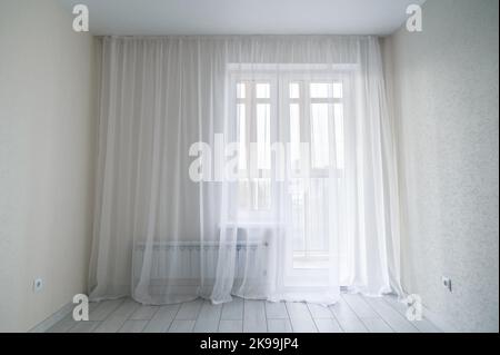 White empty modern room interior with window and balcony. Window in small, economic room background. Empty room with window Stock Photo