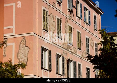 Port town Ajaccio capital of Corsica, French island in the Mediterranean Sea. typical apartment with shutters and damages plaster Stock Photo
